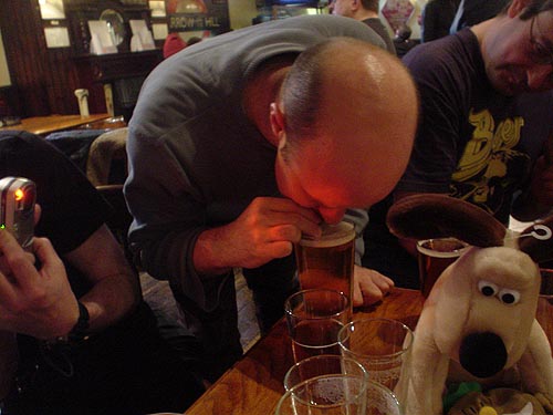 rab demonstrates the noble art of drinking beer through a chocolate biscuit